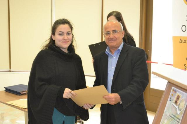 Elena Tornariti, receiving her award from Costas Katsonis, President of Cyprus IBBY